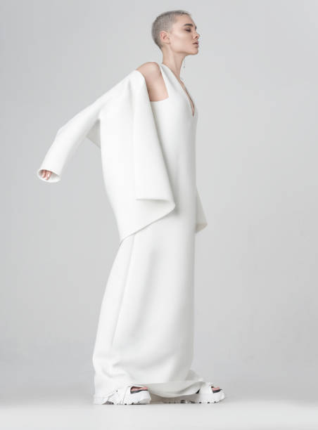 istock Stylish woman taking off white jacket 1151328087