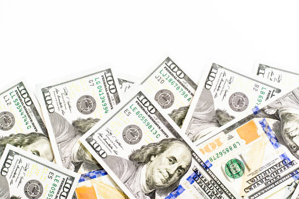 istock 100 American dollars isolated on white background 1151328277