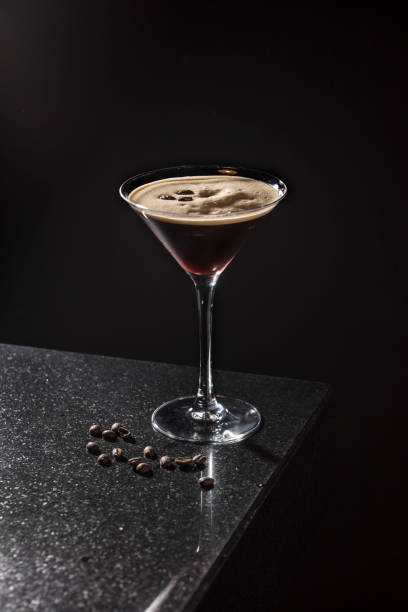 espresso martini espresso martini cocktail on black background martini stock pictures, royalty-free photos & images