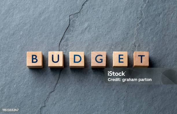 Budget Word On Wooden Blocks On Slate Base Stock Photo - Download Image Now - Budget, UK, Advertisement