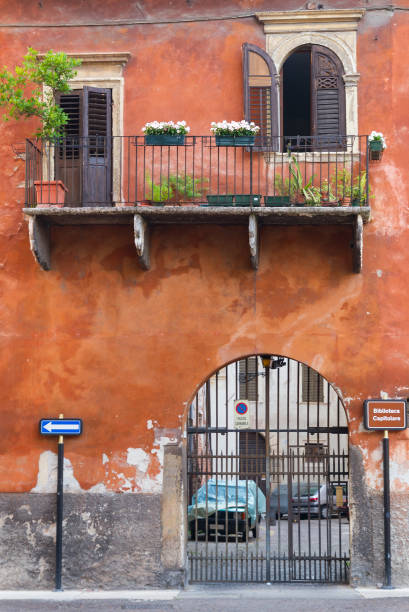 Verona, Italy- June 11, 2010:Historic street in old town with balcony and gate in Verona, Italy