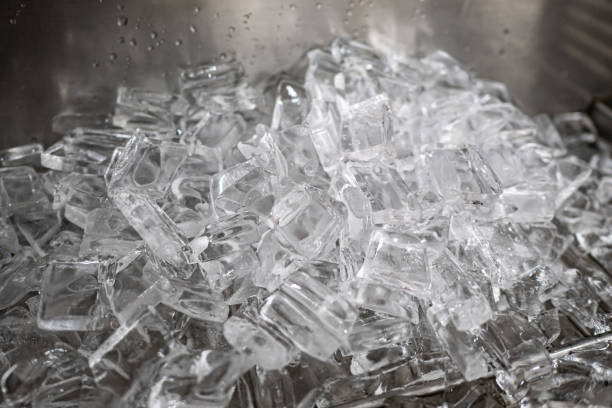 Ice cubes on ice maker machine Ice cubes on ice maker machine ice machines stock pictures, royalty-free photos & images