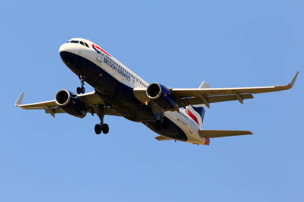 G-EUYT British Airways Airbus A320-200 aircraft on the blue sky background stock photo