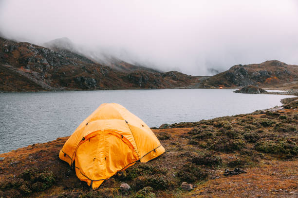 istock tent in lakeside on mountain 1151339034