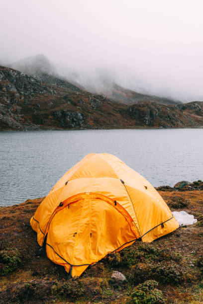 istock tent in lakeside on mountain 1151339127