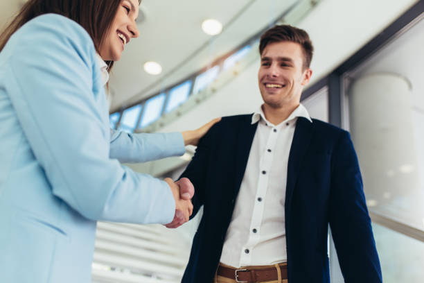 istock Business people handshaking in modern office. 1151342037