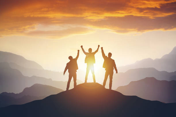 istock Silhouette of the team on the mountain 1151342046