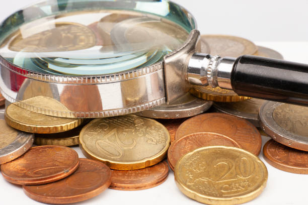 istock Pile of Euro coins isolated on white background. Selective focus 1151347032