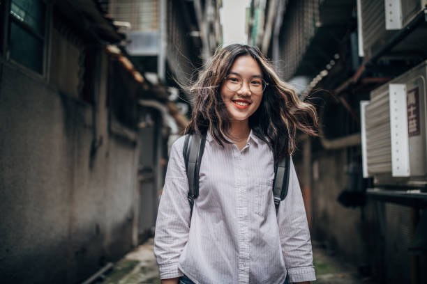 istock Young female student standing on the street 1151351028