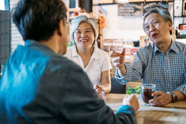 istock Family sitting in cafe and talking 1151351059