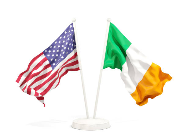 Two waving flags of United States and ireland isolated on white stock photo