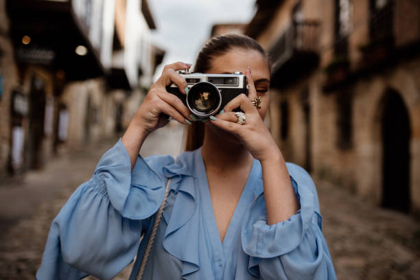 istock Young woman taking a picture 1151355795