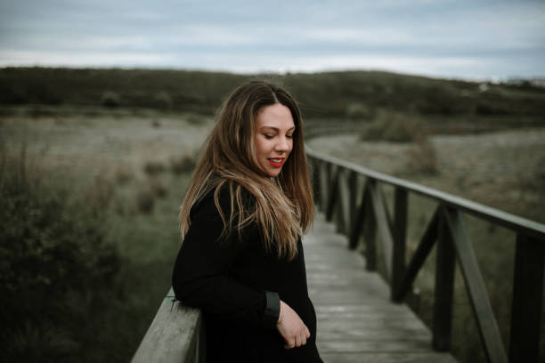 istock Young woman on a wooden walkway 1151358219