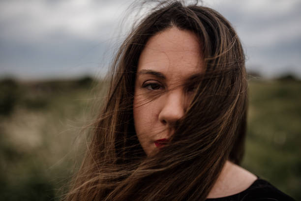 istock Young woman portrait at beach 1151358220