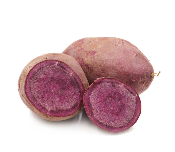 istock Purple Colored Sweet Potatoes on White background 1151358837
