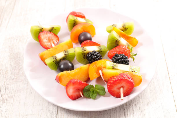 istock mixed fruit dessert on wood background 1151358869