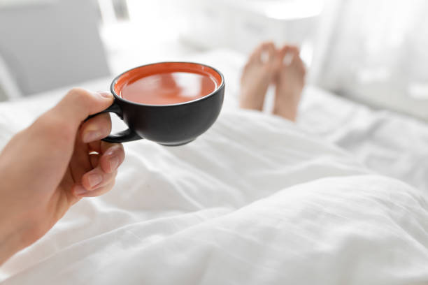 istock POV, drinking morning tea in bed 1151359589