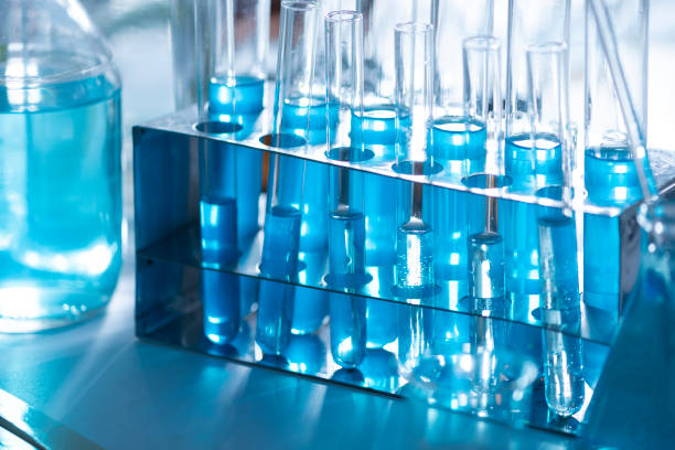 istock Different laboratory glassware with color liquid and with reflection 1151361616