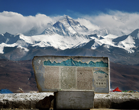 Arrival at first sight of Everest on a road trip through the Himalayas of Tibet.
Everest, known in Nepali as Sagarmatha and in Tibetan as Chomolungma, is Earth's highest mountain above sea level, located in the Mahalangur Himal sub-range of the Himalayas. The international border between Nepal and China runs across its summit point