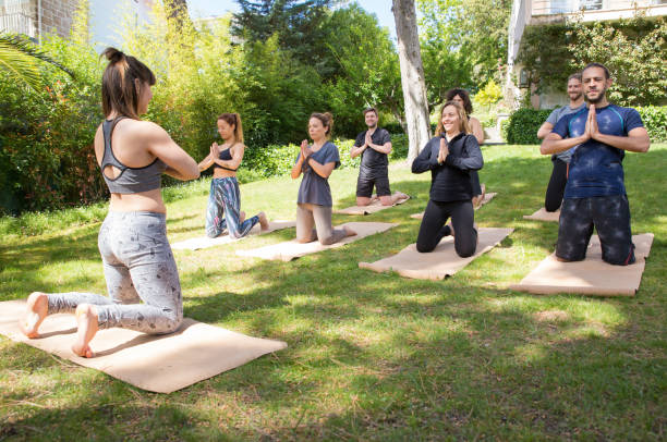 istock Peaceful people enjoying yoga practice 1151364709