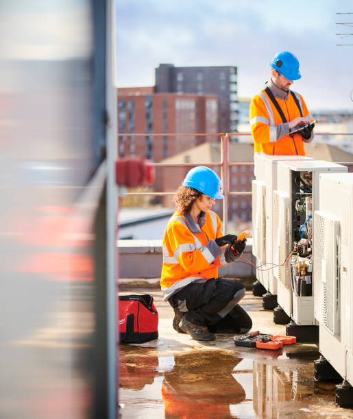 istock female electrician with aircon unit 1151365019