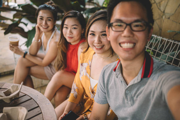 istock a group of asian chinese friends having selfie using smart phone camera 1151365021