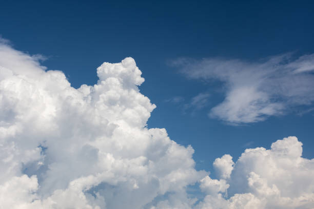 istock Beautiful huge clouds in the sky shooting from below 1151367843
