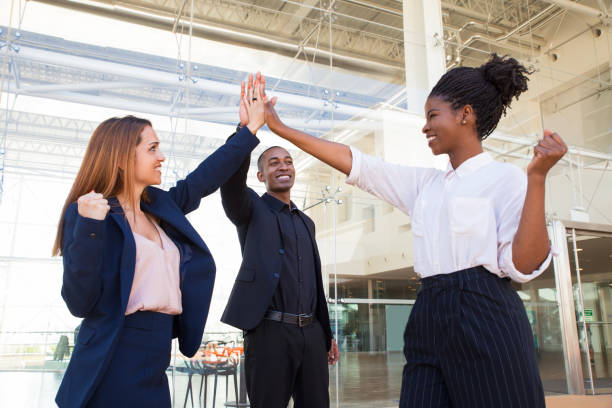 istock Happy strong business team doing high five at office 1151367883
