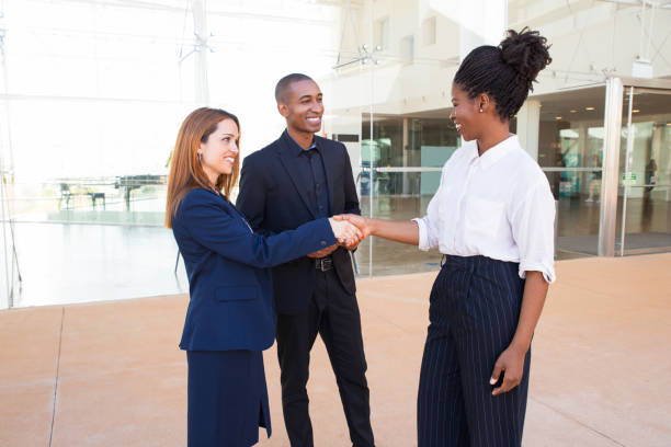 istock Satisfied business partners making handshake 1151367915