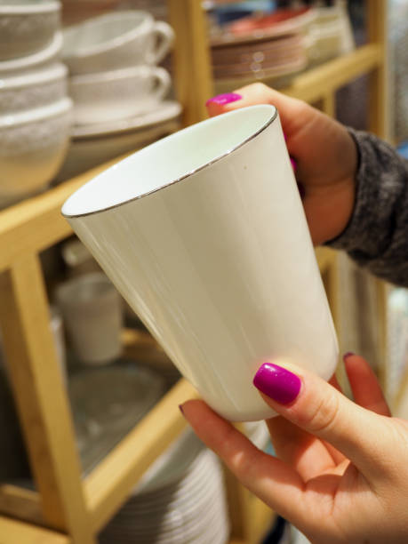 istock woman choosing new crockery in dinnerware store 1151370286