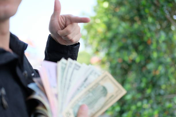 istock businessman hold a lot money copy space 1151372134