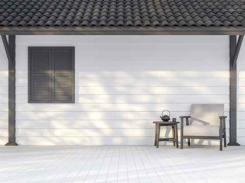 Black and white exterior wall 3d render,There are white wood plank wall,darkgray window, poles and roof ,Decorate with white fabric chair,Sunlight shining to the wall with tree shadow.