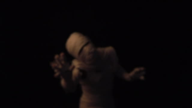 Mummy walking in darkness.l.