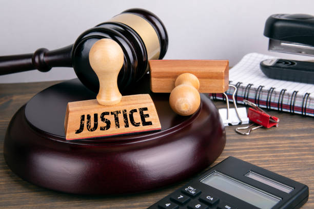 istock Justice concept. Judge gavel and stationery 1151378939