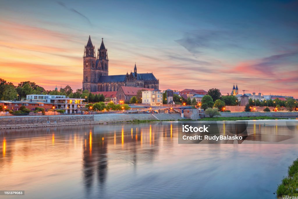 Magdeburg, Germany. Cityscape image of Magdeburg, Germany with reflection of the city in the Elbe river, during sunset. Magdeburg Stock Photo