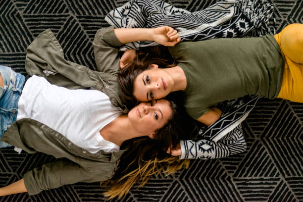 istock Lesbian couple lying on the floor 1151379619