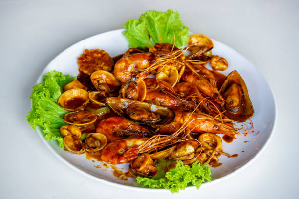 istock seafood - Spicy mixed seafood in Thai Style (goong thang) 1151382249