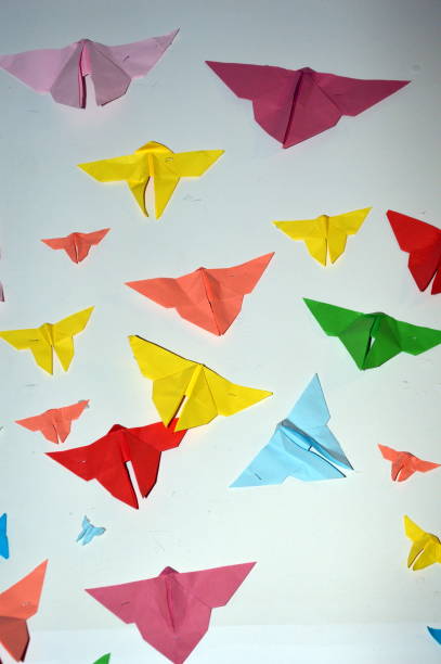 istock Paper Butterflies on a white wall 1151383625