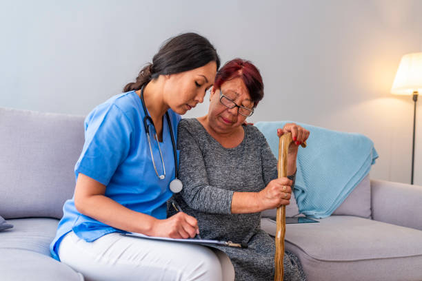 istock Happy patient is holding caregiver for a hand while spending time together. 1151384191