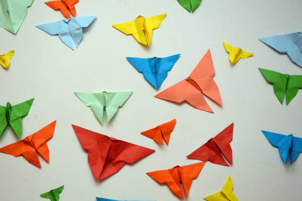 istock Paper Butterflies on a white wall 1151385550