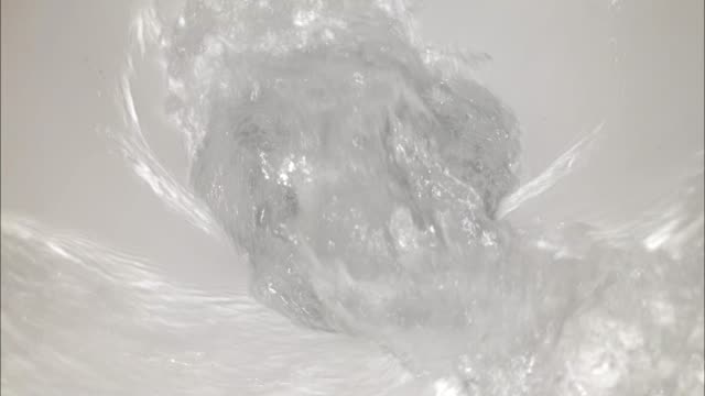 Flush water in the toilet in the close-up slow motion