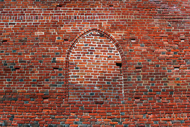 istock Old red brick masonry and stone slabs background 1151388018