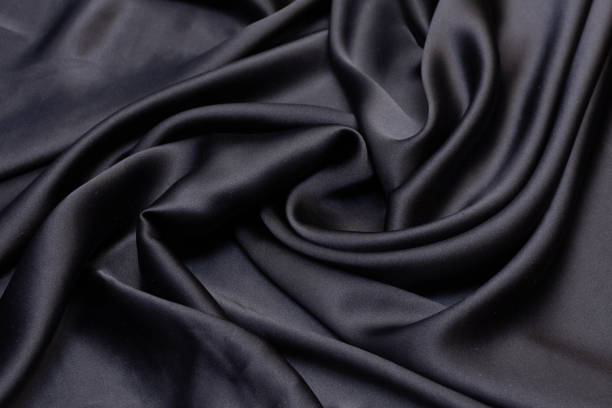 istock Silk satin fabric in black in artistic layout 1151388169