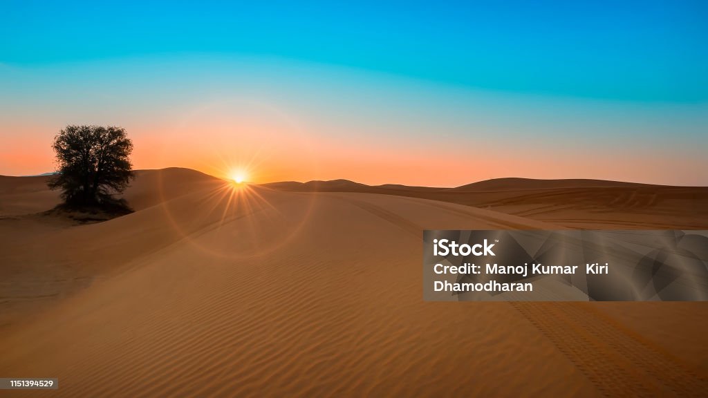 Desert Sunrise at Dubai Desert Sunrise with sand doom Desert Area Stock Photo