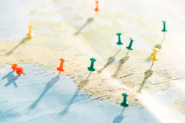 istock selective focus of world map with colorful push pins 1151398866