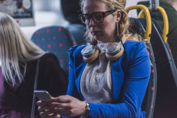 istock Business woman using mobile in public transport. 1151399732