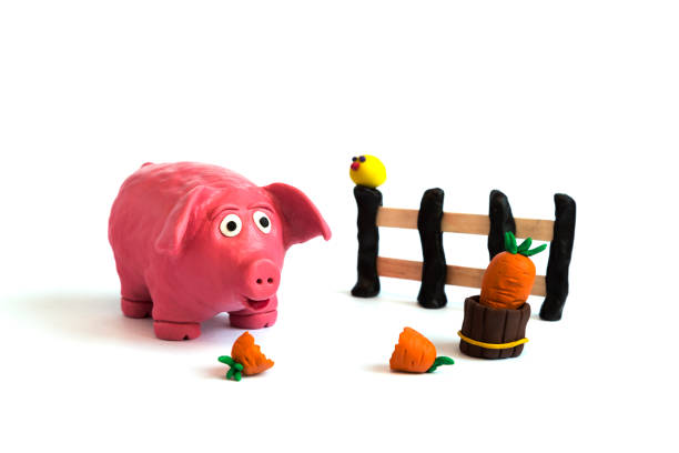 Handmade plasticine clay pig farm on white background, isolated