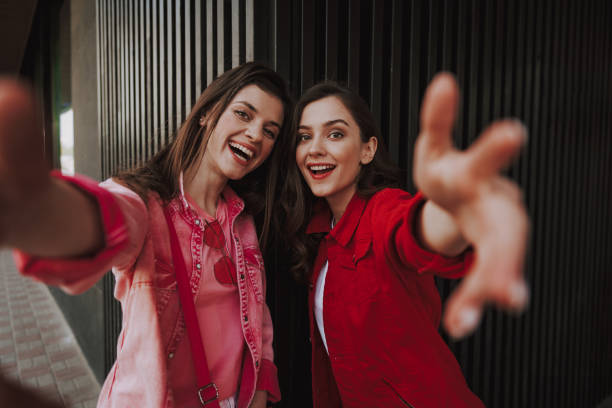 istock Two happy hipster girls making selfie together 1151404954
