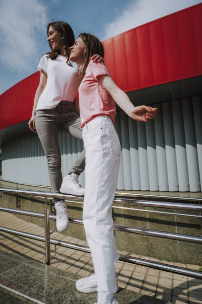istock Pretty hipster girls enjoying time on walk 1151404969