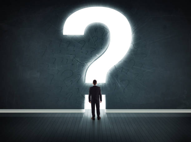 Business man looking at wall with a bright question mark Business man looking at wall with a bright question mark concept question mark people one person silhouette stock pictures, royalty-free photos & images